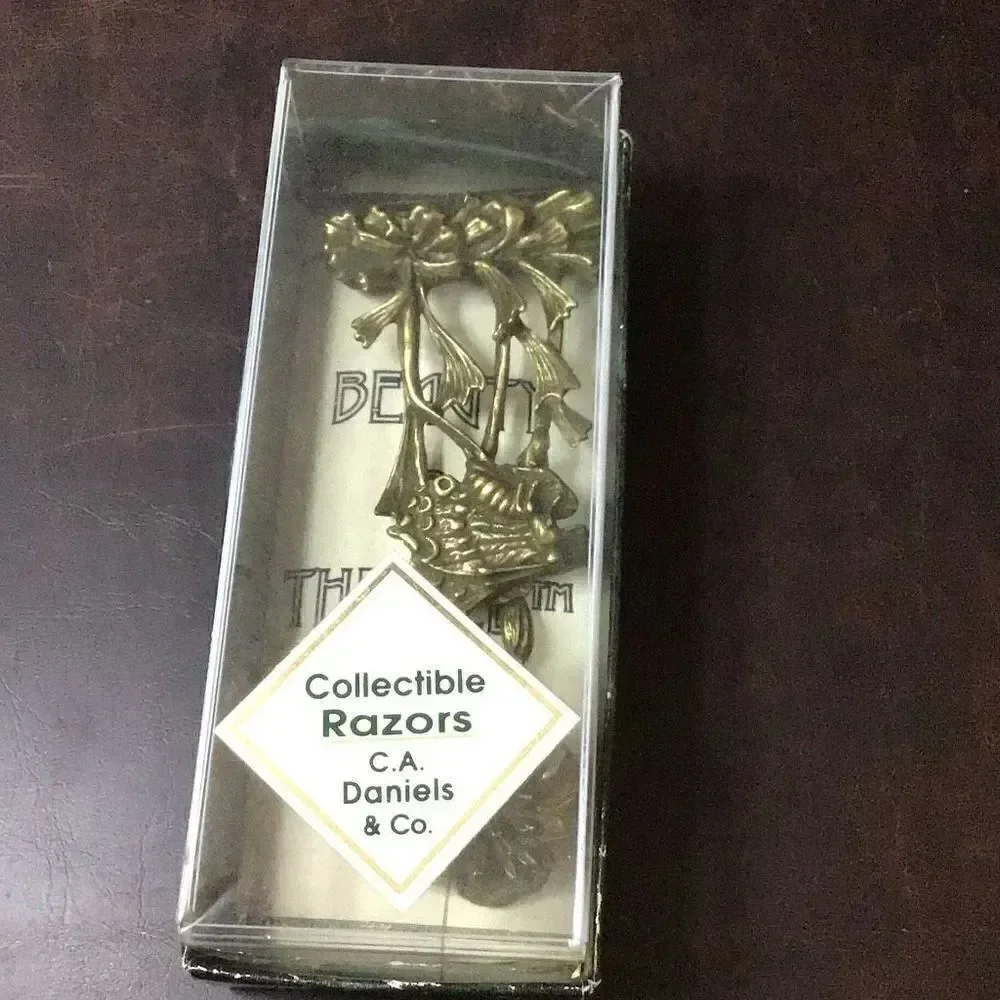 Vintage ornate, solid, brass, ladies, razor the beauty and the bee from C.A. Dan